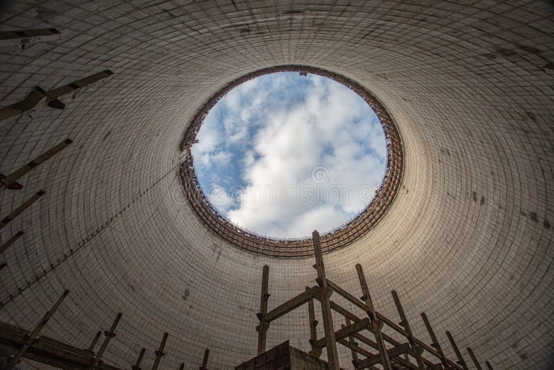 Futuristic view inside of cooling tower of unfinished Chernobyl nuclear power plant. Catastrophe, industry.