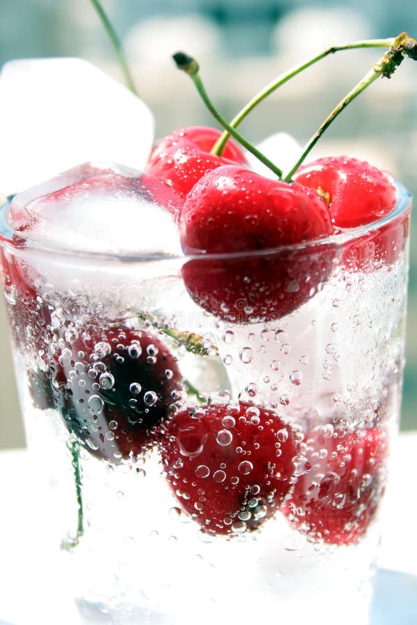 Cherries in glass with ice stock image. Image of macro 1719209