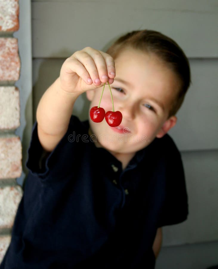 Cherry boy blur 3 stock photo. Image of fruit, snack, cherry 5193126