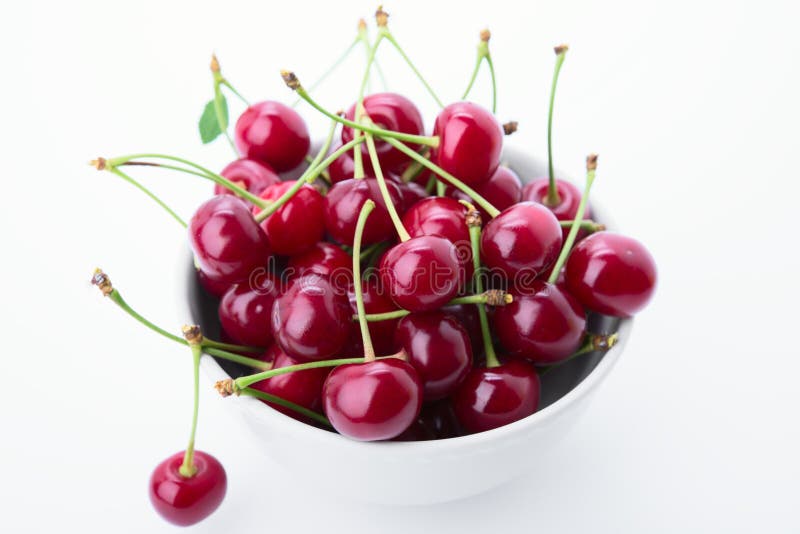 Cherry is in a cup stock photo. Image of color, stem 25187196