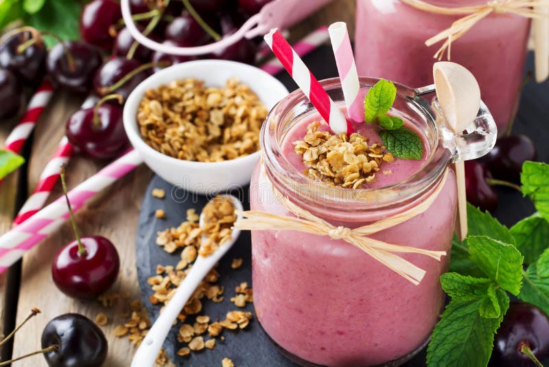 Cherry Healthy Smoothie with Granola and Berries. Stock Photo Image