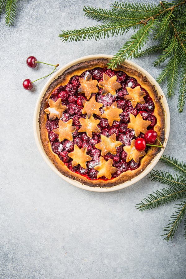 Cherry piecake with fresh cherry. Christmas decotation stock image