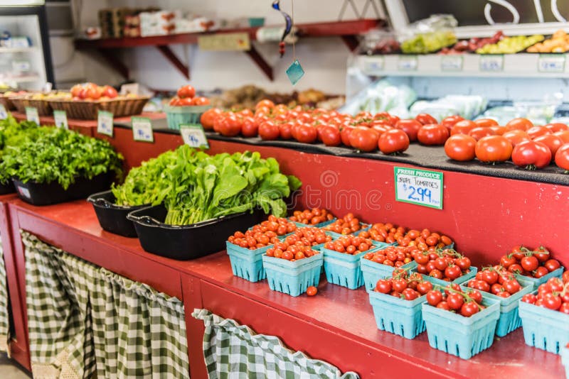 Cherry Tomatoes and other vegetables on shelves at country grocer in Hudson Valley, New York. Cherry Tomatoes and other vegetables on shelves at country grocer in Hudson Valley, New York.
