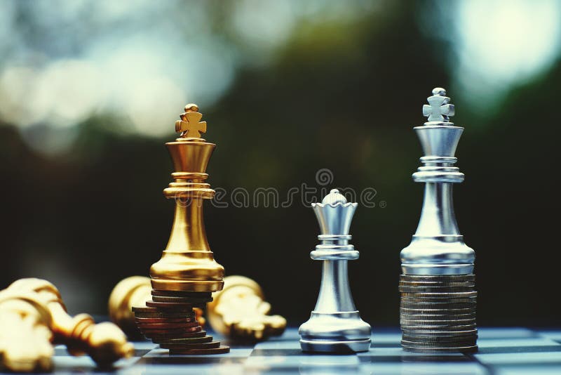 Investment Leadership Concept : The king chess piece with chess others  nearby go down from floating board game concept of business ideas and  competition and strategy plan success meaning. Stock Photo