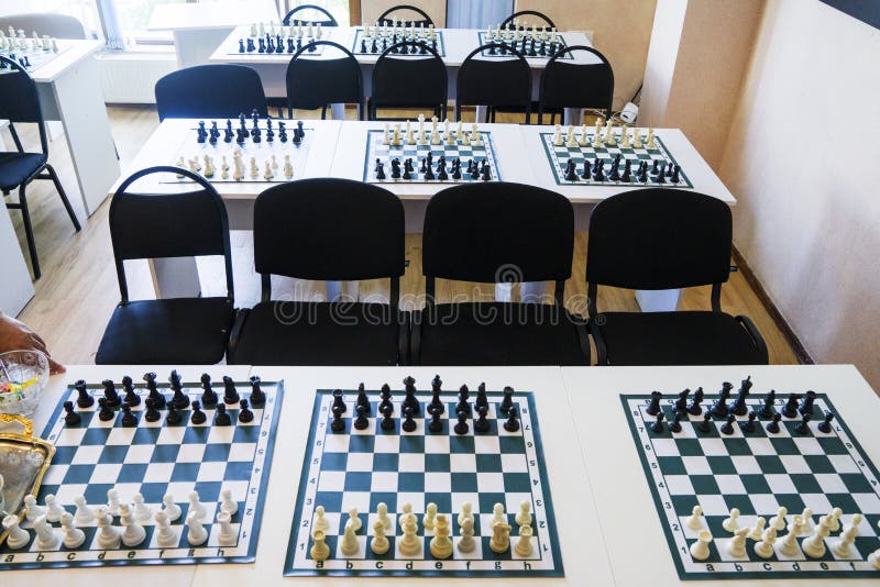 Chess Boards with Black and White Pieces on the Table Stock Image