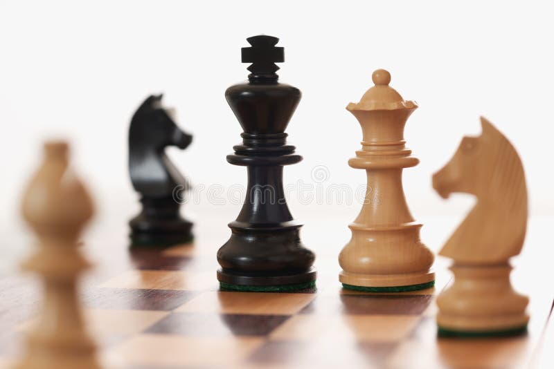 Chess game white queen challenging black king