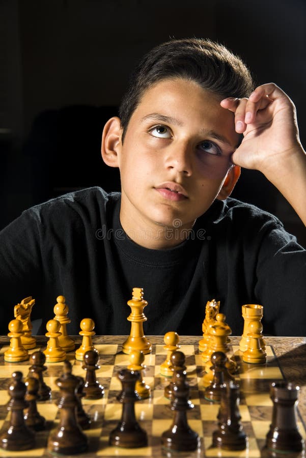 Young Boy Planning His Next Move during a Game of Chess Stock Photo - Image  of sports, india: 116808594