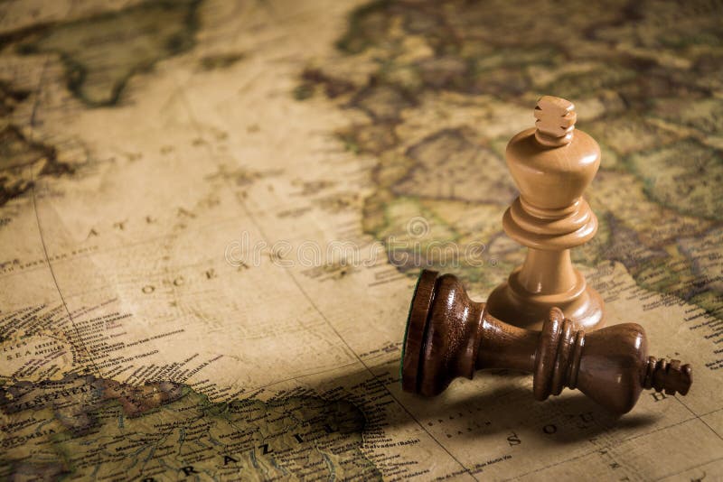 Compass and Chess on old map Stock Photo by ©kwanchaidp 75914583