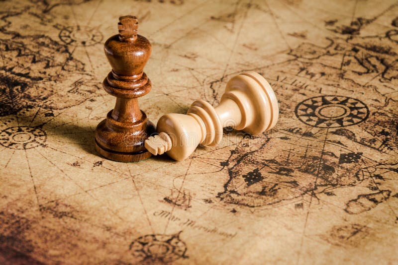 Compass and Chess on old map Stock Photo by ©kwanchaidp 75914583