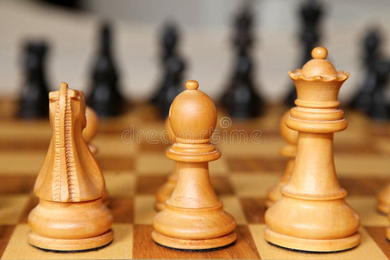 Chess pieces on the board stock photo. Image of western 269568402