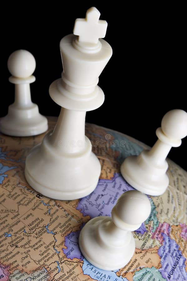 Chess pieces on an earth globe