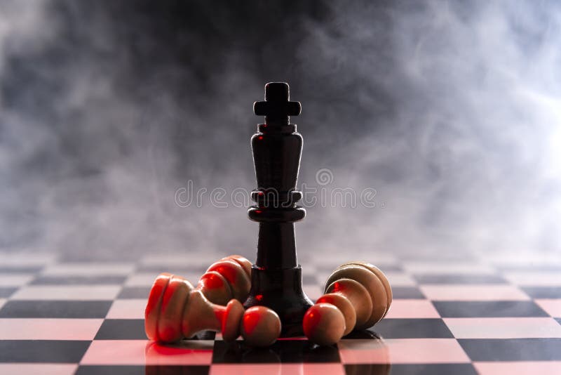 Chess queen defeats a batch of white pawns on a chessboard on a background with smoke
