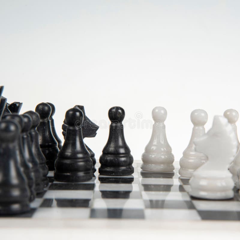 Chessboard with Black and White Pieces Strategy Concept Stock Photo