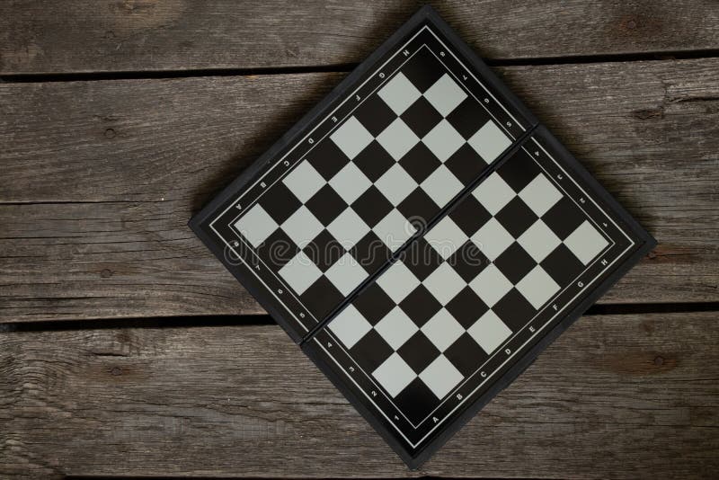 brown chess board with figures on a wooden table in a cafe, playing chess  Stock Photo - Alamy