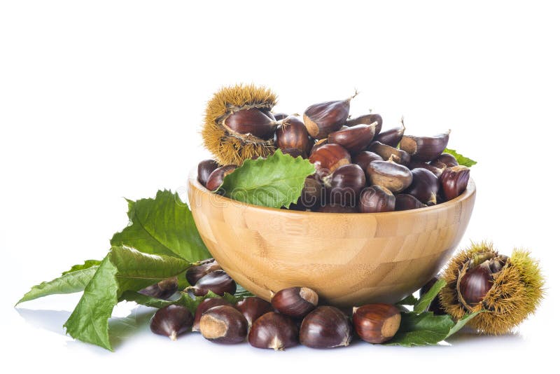 Chestnuts in a wooden bowl isolated on a white background