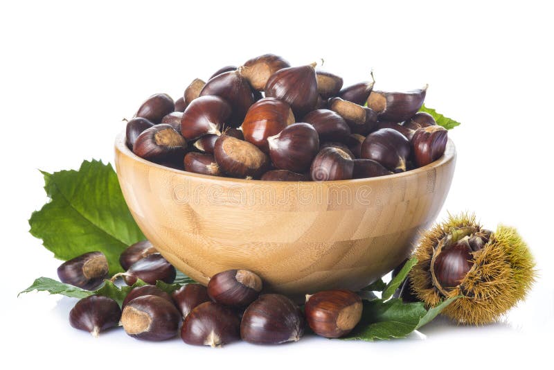 Chestnuts in a wooden bowl isolated on a white background