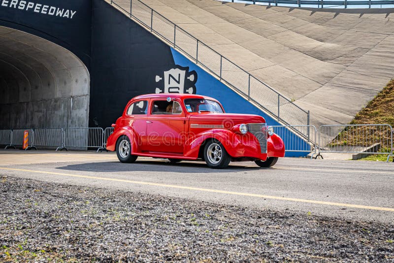 Lebanon, TN - May 14, 2022: Wide angle front corner view of a 1939 Chevrolet 2 Door Sedan driving on a road leaving a local car show