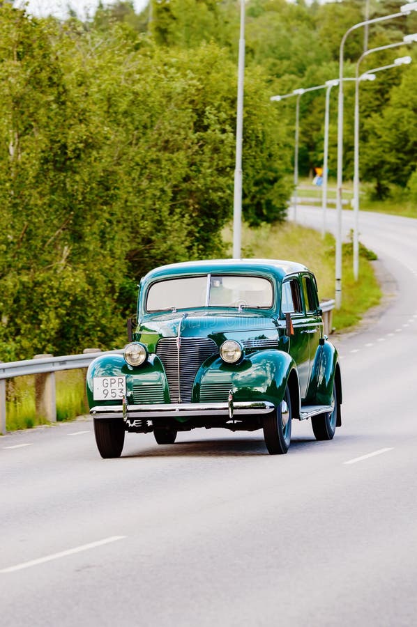 Ronneby, Sweden - June 26, 2015: Veteran car street cruise on public roads. Chevrolet super deluxe 1939 green.