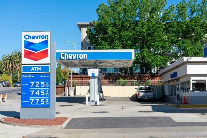 Chevron gas station exterior view. Gas station price sign showing high gasoline price for over 7 dollars a gallon for regular gas