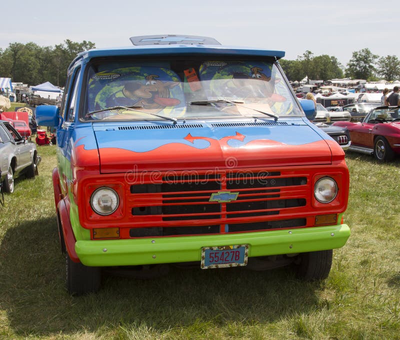 IOLA, WI - JULY 13: Front of 1974 Chevy Scooby Doo Mystery Machine Van at Iola 41st Annual Car Show July 13, 2013 in Iola, Wisconsin. IOLA, WI - JULY 13: Front of 1974 Chevy Scooby Doo Mystery Machine Van at Iola 41st Annual Car Show July 13, 2013 in Iola, Wisconsin.