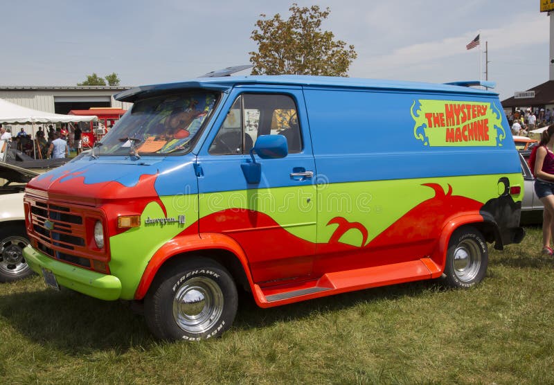 IOLA, WI - JULY 13: Side of 1974 Chevy Scooby Doo Mystery Machine Van at Iola 41st Annual Car Show July 13, 2013 in Iola, Wisconsin. IOLA, WI - JULY 13: Side of 1974 Chevy Scooby Doo Mystery Machine Van at Iola 41st Annual Car Show July 13, 2013 in Iola, Wisconsin.