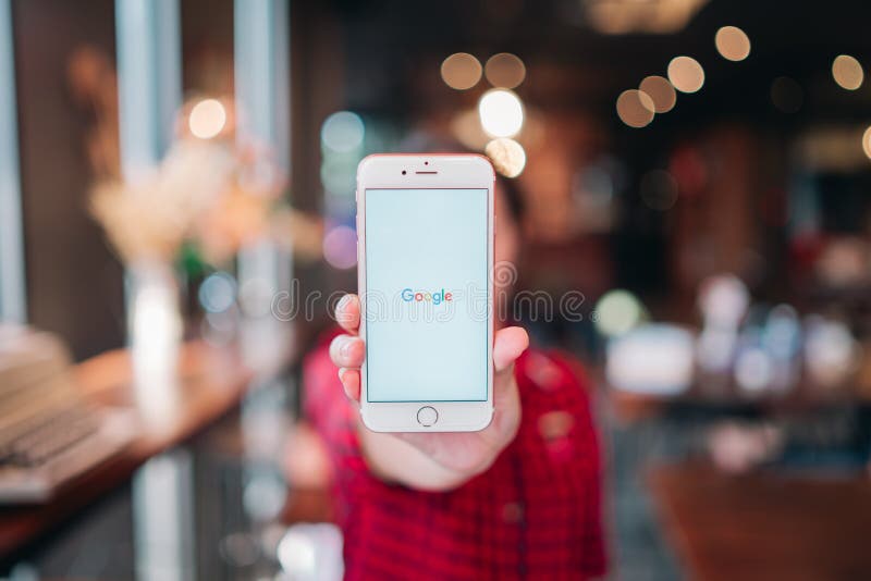 CHIANG MAI, THAILAND - Apr.08,2019: Woman holding Apple iPhone 6S Rose Gold with google apps on screen. Google is the biggest royalty free stock photography CHIANG MAI, THAILAND - Apr.08,2019: Woman holding Apple iPhone 6S Rose Gold with google apps on screen. Google is the biggest royalty free stock photography