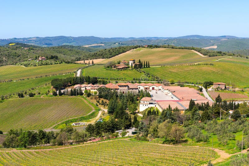 Chianti Region, Italy - April 21, 2018: Farmland rural landscape, cypress trees, vineyards and olive trees from Castello di Brolio royalty free stock photos Chianti Region, Italy - April 21, 2018: Farmland rural landscape, cypress trees, vineyards and olive trees from Castello di Brolio royalty free stock photos