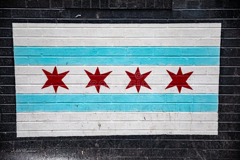 Chicago flag painted on black bricks. Chicago Illinois flag with blue and white stripes and red stars painted on black brick with natural grunge