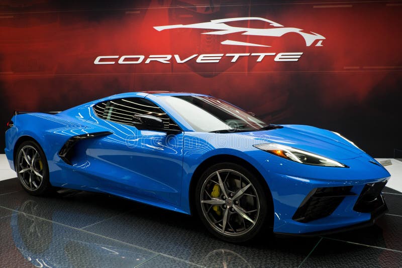 CHICAGO, ILLINOIS - February 8, 2020: Beautiful blue 2 door coupe all-new 2020 Corvette Stingray sports car displayed on a red background with logo at McCormick Place at the annual Chicago Auto Show. CHICAGO, ILLINOIS - February 8, 2020: Beautiful blue 2 door coupe all-new 2020 Corvette Stingray sports car displayed on a red background with logo at McCormick Place at the annual Chicago Auto Show