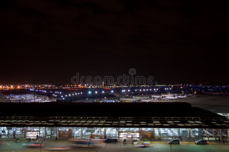 CHICAGO, ILLINOIS, UNITED STATES - MAY 11th, 2018: Outside of Chicago O`Hare International Airport at night with some royalty free stock photography CHICAGO, ILLINOIS, UNITED STATES - MAY 11th, 2018: Outside of Chicago O`Hare International Airport at night with some royalty free stock photography