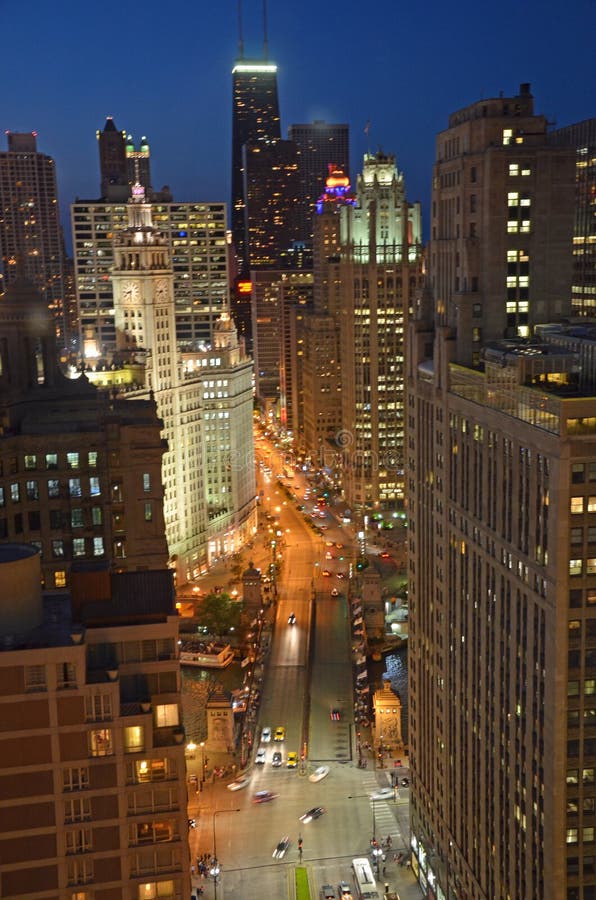 Chicago - August 12: aerial view of Michigan Avenue Bridge and the skyline in Chicago at night, USA, on August 12, 2015. The bridge links the Magnificent Mile with the southern Loop District. Chicago - August 12: aerial view of Michigan Avenue Bridge and the skyline in Chicago at night, USA, on August 12, 2015. The bridge links the Magnificent Mile with the southern Loop District.