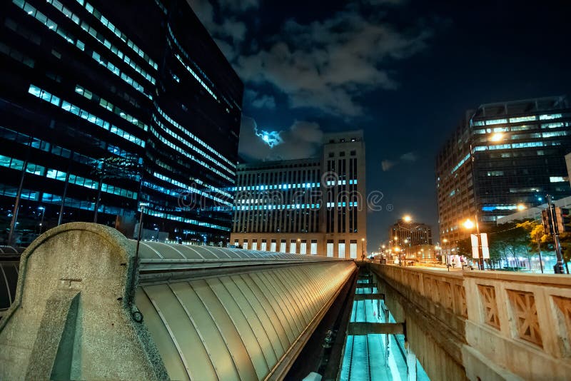 Chicago skyline with the Union Station train vents and dramatic clouds and moon at night. Night train stock images, royalty-free photos and pictures