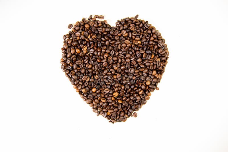 Chicchi di caffè nella forma della vista superiore del cuore immagini stock libere da diritti Chicchi di caffè nella forma della vista superiore del cuore immagini stock libere da diritti
