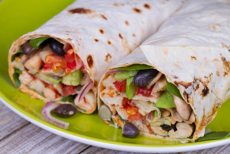 Chicken, Avocado, Tomato and Black Beans Burritos. Stock Image Image