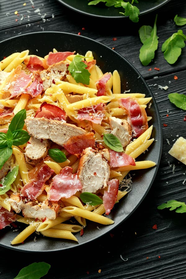 Chicken, Bacon Penne Pasta with Parmesan Cheese and Basil. Healthy Food