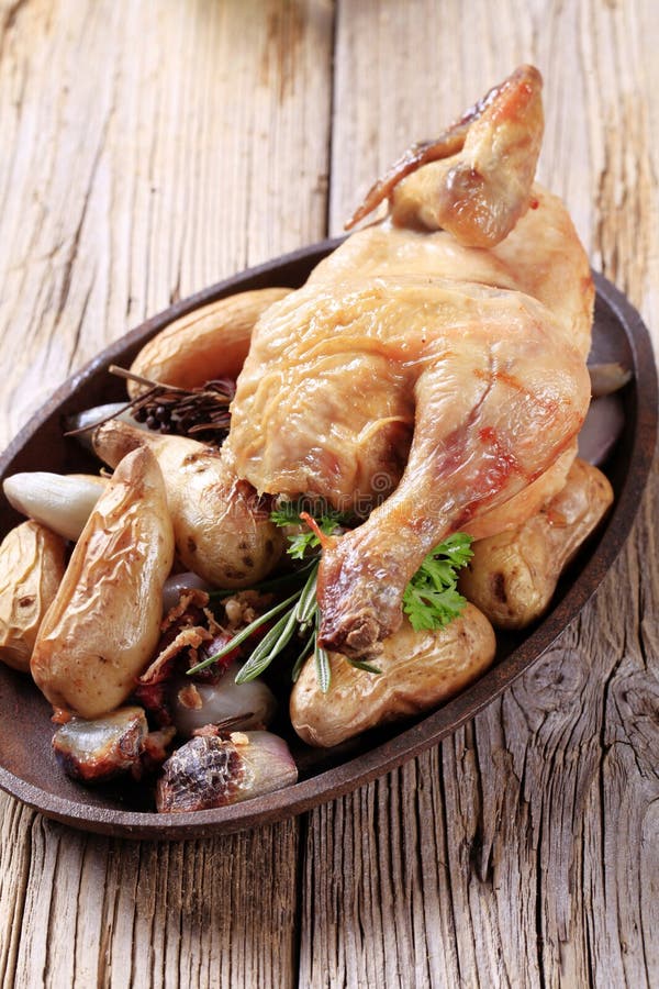 Chicken and baked potatoes stock photo. Image of iron - 23058366