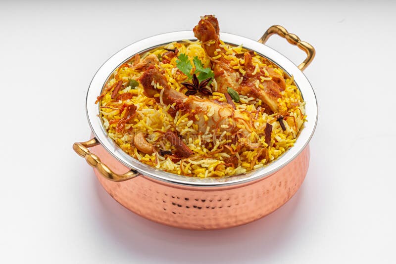 Chicken biryani , kerala style chicken dhum biriyani made using jeera rice and spices arranged in a brass serving bowl with white background, isolated. Chicken dum biryani stock images, royalty-free photos and pictures