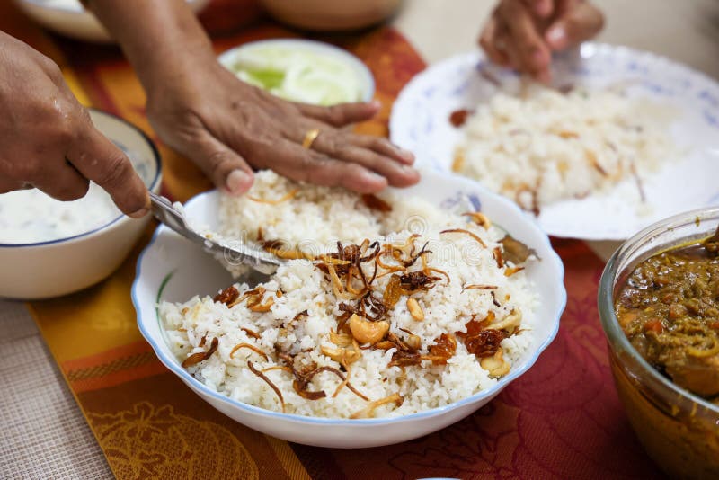Chicken biryani Spicy Indian Malabar biryani Hyderabadi biryani, Dum Biriyani pulao golden bowl Kerala India Sri Lanka Pakistan basmati rice mixed rice dish with meat curry Ramadan Kareem, Eid. Chicken dum biryani stock images, royalty-free photos and pictures