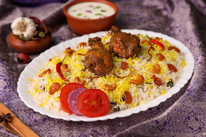 Chicken biryani Spicy Indian Malabar biryani Hyderabadi biryani, Dum Biriyani pulao golden bowl Kerala India Sri Lanka Pakistan basmati rice mixed rice dish with meat curry Ramadan Kareem, Eid. Chicken dum biryani stock images, royalty-free photos and pictures