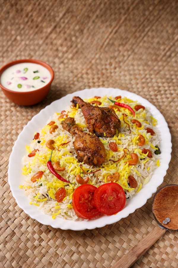 Chicken biryani Spicy Indian Malabar biryani Hyderabadi biryani, Dum Biriyani pulao golden bowl Kerala India Sri Lanka Pakistan basmati rice mixed rice dish with meat curry Ramadan Kareem, Eid. Chicken dum biryani stock images, royalty-free photos and pictures