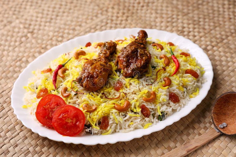 Chicken biryani Spicy Indian Malabar biryani Hyderabadi biryani, Dum Biriyani pulao golden bowl Kerala India Sri Lanka Pakistan basmati rice mixed rice dish with meat curry Ramadan Kareem, Eid. Chicken dum biryani stock images, royalty-free photos and pictures