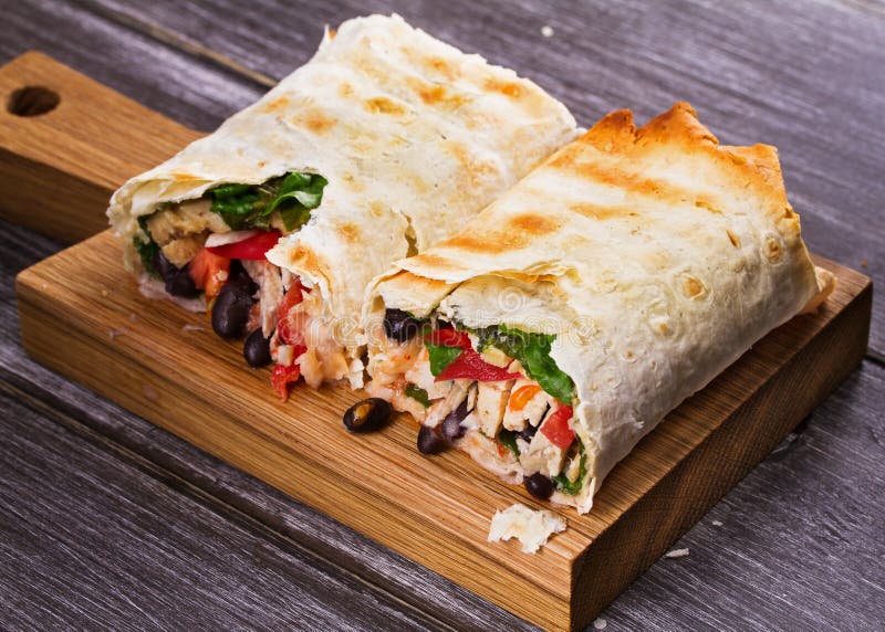Chicken, Black Beans, Spinach and Tomato Burritos. Stock Image Image