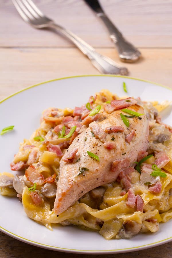 Chicken Breast and Egg Noodles with Bacon and Mushrooms in Creamy Sauce
