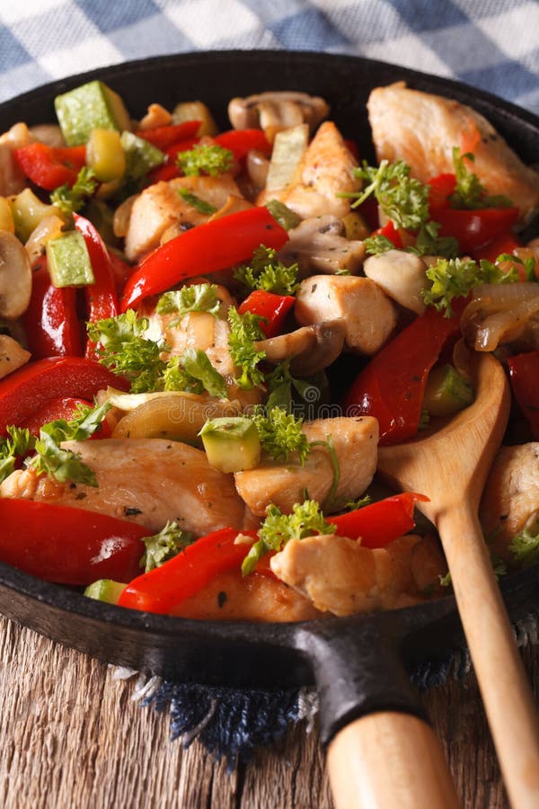 Chicken Breast Fried with Mushrooms, Peppers and Zucchini Closeup on a ...