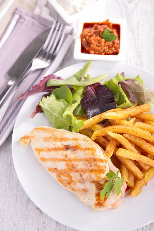 Chicken breast and fries stock image. Image of chicken 40747945