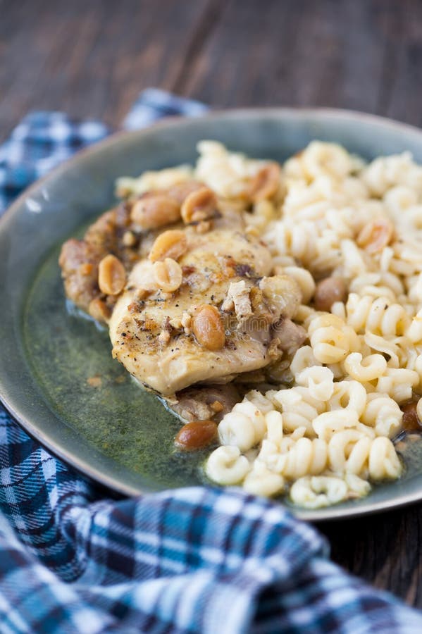 Chicken Breast with Pasta and Sauce Stock Photo - Image of rustic