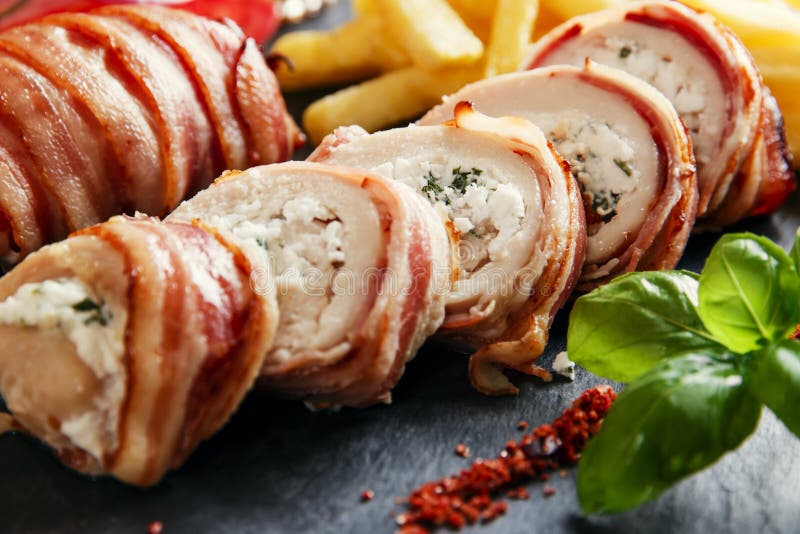 Chicken Breast Stuffed Feta Cheese and Herbs in Bacon Stock Image