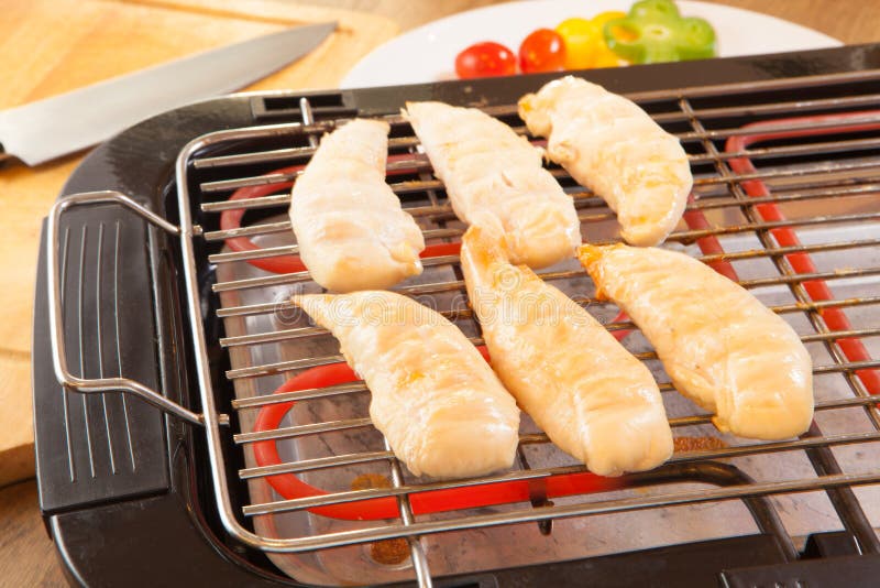 Chicken Breasts Fillet on Electric Barbecue and Grill Stock Image