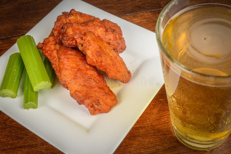 Beer and Buffalo Wings stock image. Image of barbecue 34001793