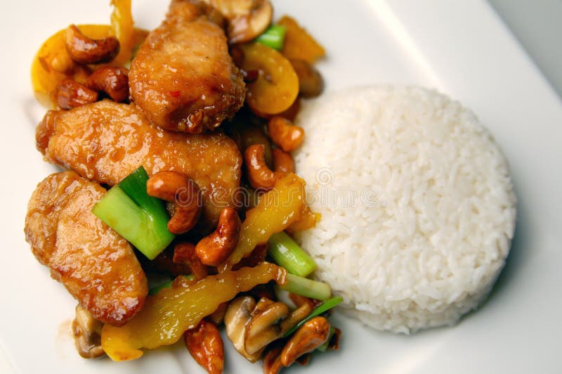 A plate of chicken with cashew nuts, served with rice. Crispy diet stock images, royalty-free photos and pictures